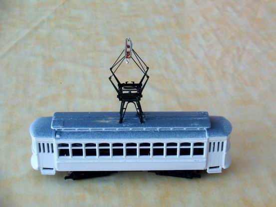 Tram with tower and pantograph